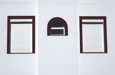 three windows on a wall