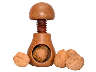 a wooden nutcracker and walnuts.