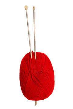 a red ball of wool and knitting needles.