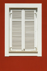 white window on a red facade