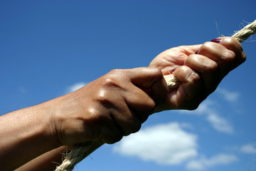 hands pulling on rope