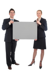 business couple holding blank sign