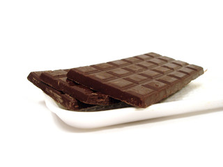 chocolate on a plate over white background