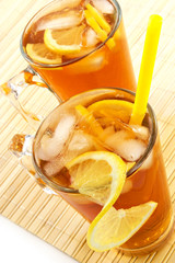 cold tea with cubes of an ice and a lemon