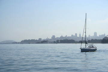 sailing boat and san francisco skyline