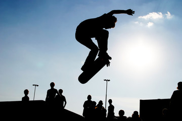 jumping skateboarder silhouette © logoboom
