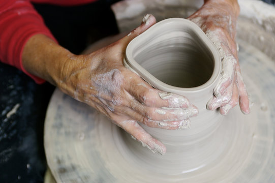 potter working clay