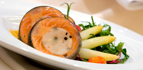 atlantic salmon around a scallop