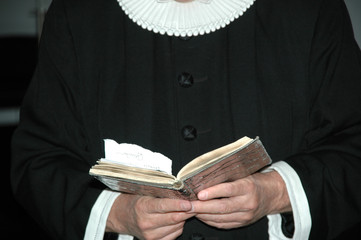 priest and bible