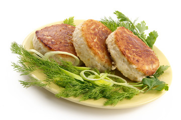 juicy pork chops with a garnish from greens