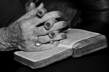 senior's hands in prayer