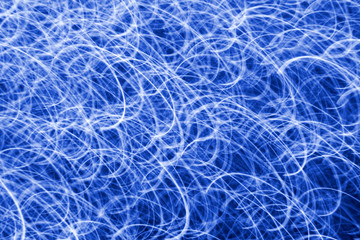 blue curved light streaks background.