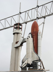 space shuttle and booster rockets on launchpad