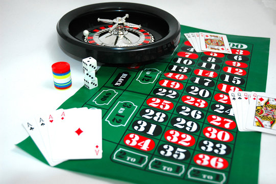 dice,chips roulette wheel and playing cards