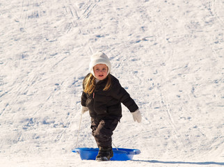 Fototapeta na wymiar girl sledding