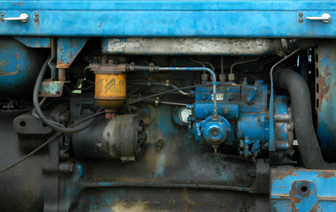Obraz na płótnie Canvas tractor engine in blue