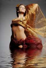 artistic beautiful woman in water