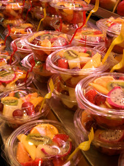 fruit cocktail in plastic bowls, fruit market, bar