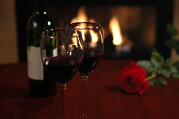 wine and rose with fireplace as background