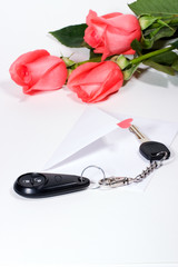 car keys and roses bouquet present