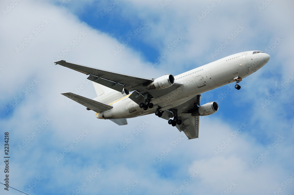 Sticker heavy cargo jet flying overhead