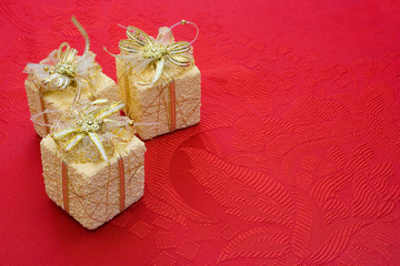 three gifts on red background