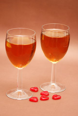 two wine glasses and heart shapes