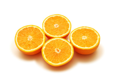 four half-cut oranges isolated on white