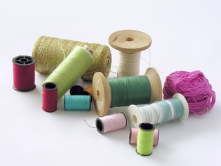 several bobbins with colorful cooton threads