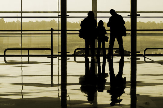 Family Waiting At The International Airport Terminal