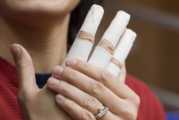 bandage up on fingers of a hand.