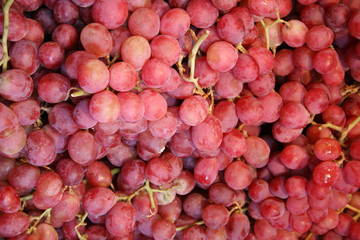 fresh red grapes at market stall