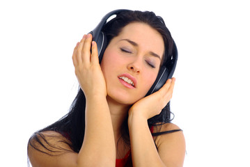 Naklejka premium young beautiful happy women listening music in hea