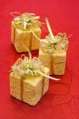 three gifts on red background