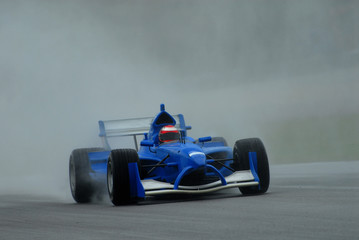 stock photo of high speed motor car racing.