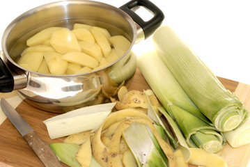 preparing dinner, peeling potatoes and leek