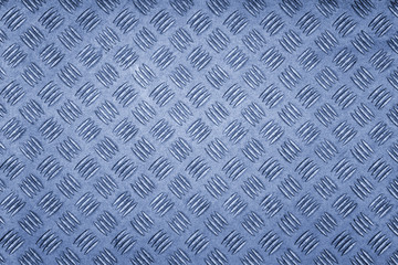 blue colored metal patterned background.