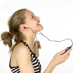 happy teen listening to mp3 in studio
