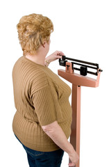 over the shoulder look at a woman checking her weight