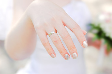 bride's hand with a ring closeup