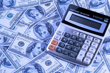 Fototapeta premium calculator over money