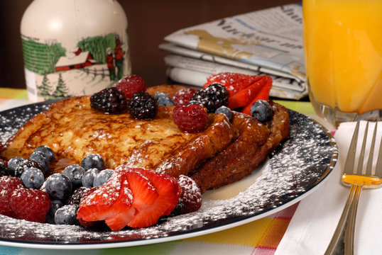 Plate Of French Toast With Fruit And Maple Syrup