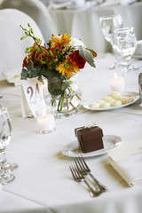 fancy wedding tables with flowers and gift