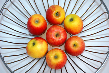 apples in steel fruit bowl