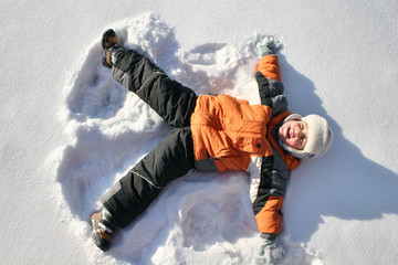 boy lies on north pole snow