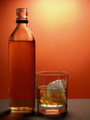 opened bottle and glass