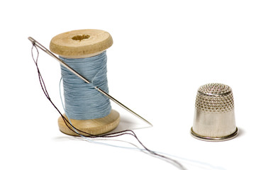 spool of thread with needle