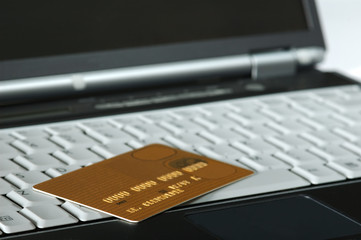 gold credit card and notebook