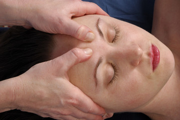 massaging forehead at wellness center