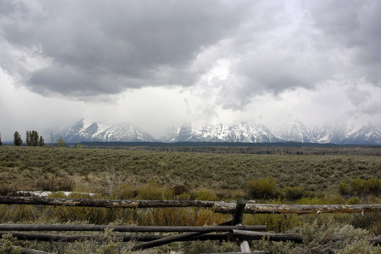 fenceline and the cloudy grand tetons